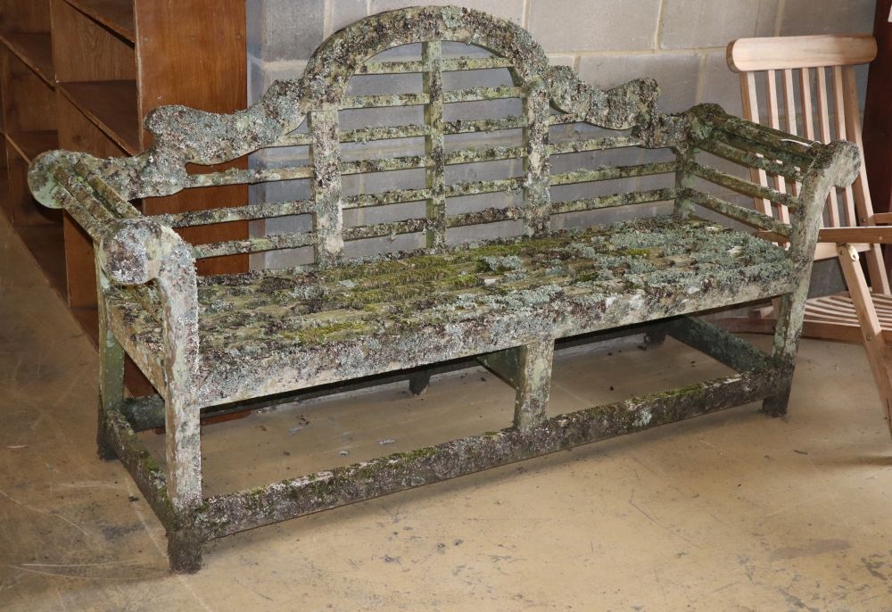 A Lutyens style weathered teak garden bench, W.200cm, D.50cm, H.106cm